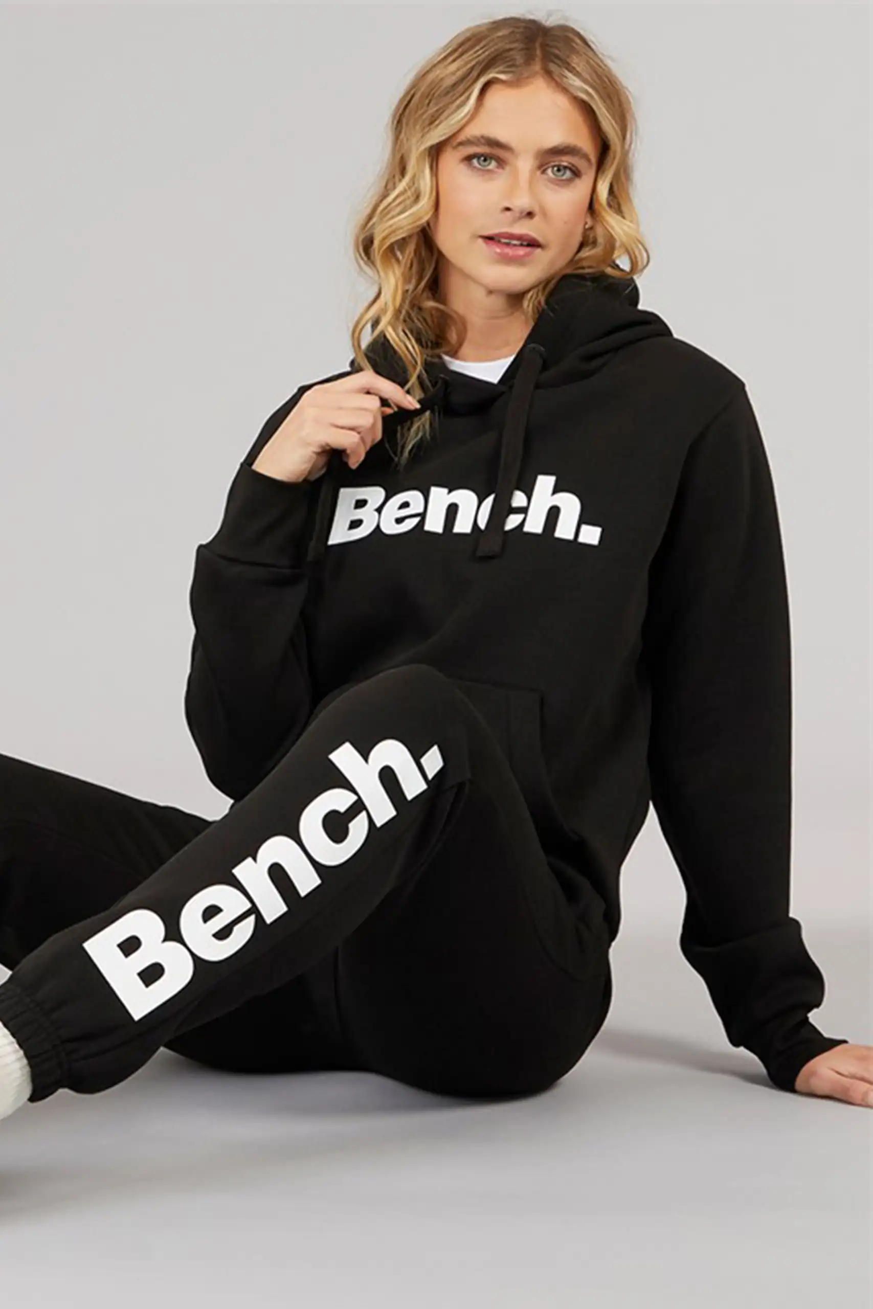 Women wearing cotton blend tracksuit with hoodie and joggers in casual style